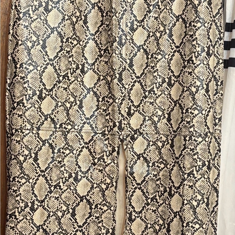 Snake Print Leather Maxi skirt in Beige and Black also has pockets .